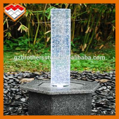 Stone modern outdoor fountain with crystal column